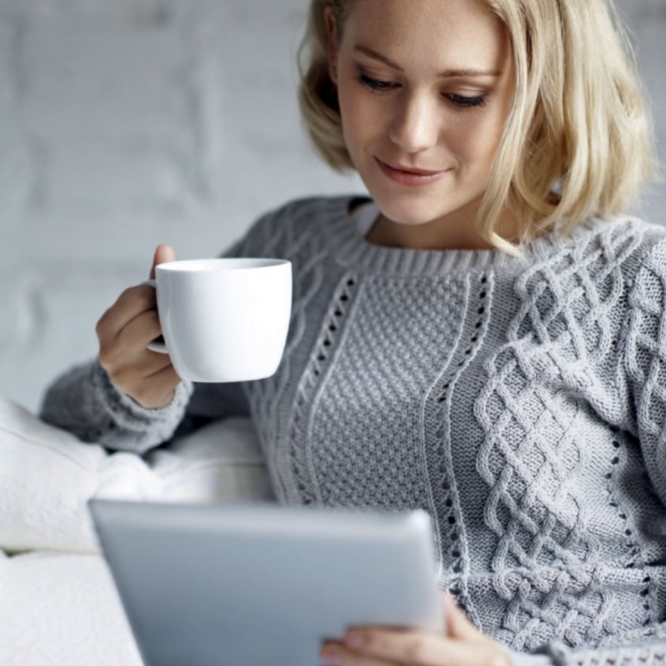 Woman reading tablet