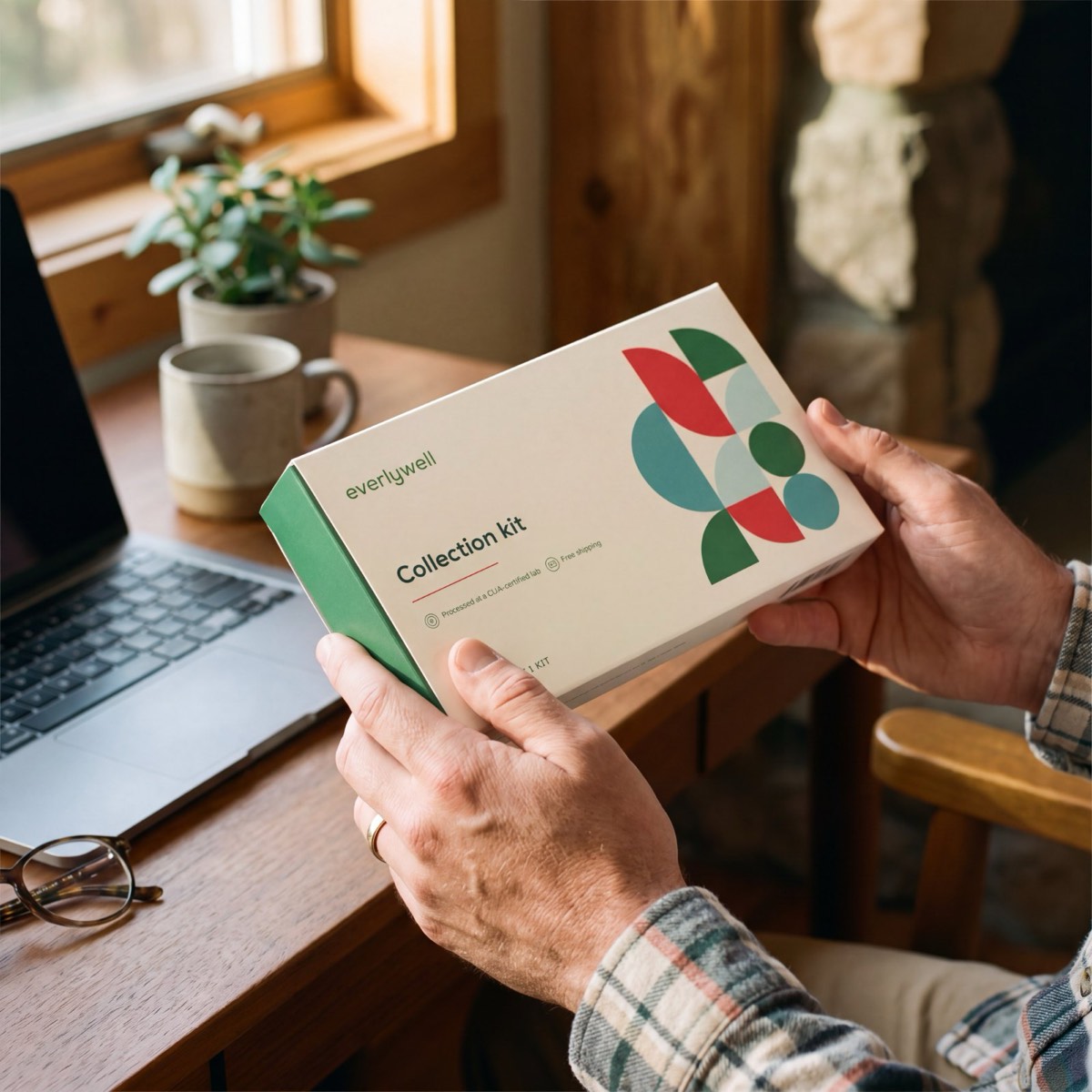 The HbA1c Test kit in hand at home