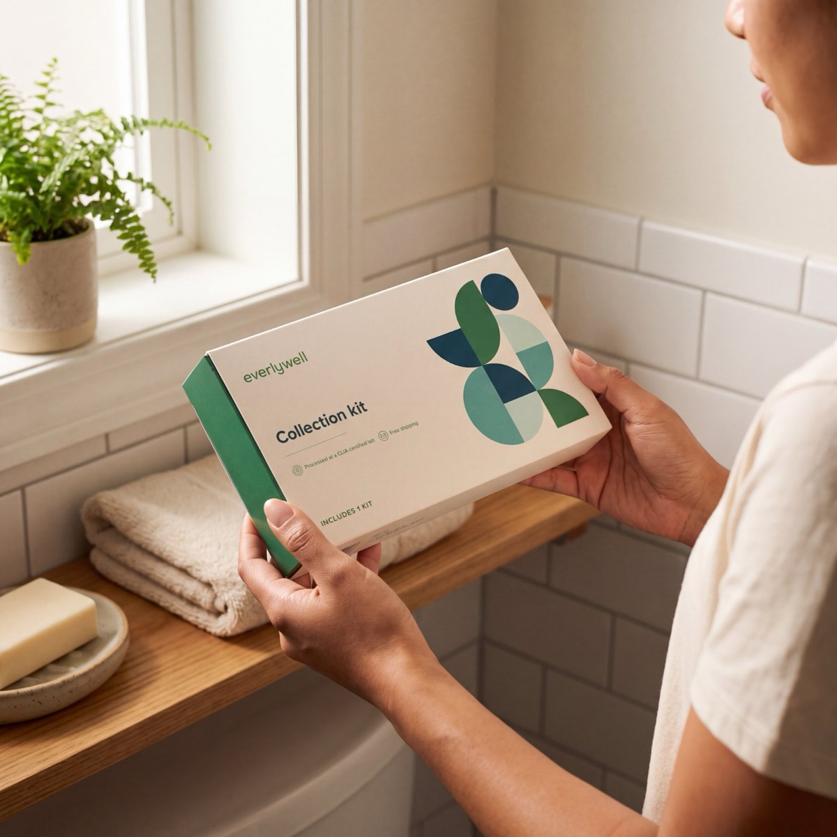 The Trichomoniasis Test kit in hand at home